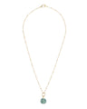 Birds Eye View of Roman Sea Glass Necklace. Necklace Features Roman Sea Glass in the Shape of a Circle Hanging From a Tiny Gold Ring and Matte Gold Satellite Chain. 