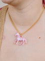 Closer Up Image of Model Wearing Pink Pony Pendant Necklace With Gold Chain