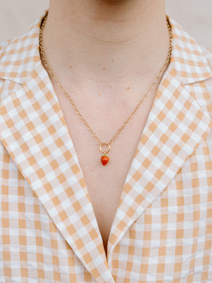 Closer Up Image of Model Wearing Red Strawberry Necklace With Gold Chain