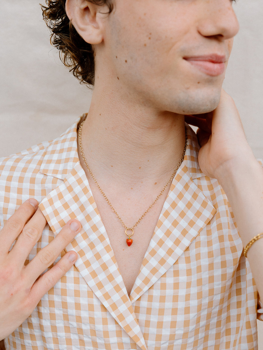 Model Wearing Strawberry Charm Necklace with Gold Chain 
