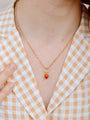 Closer Up Image of Model Wearing Red Strawberry Necklace With Gold Chain
