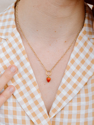 Closer Up Image of Model Wearing Red Strawberry Necklace With Gold Chain