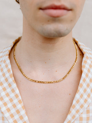 Closer Up Image of Model Wearing Gold Figaro Chain Necklace