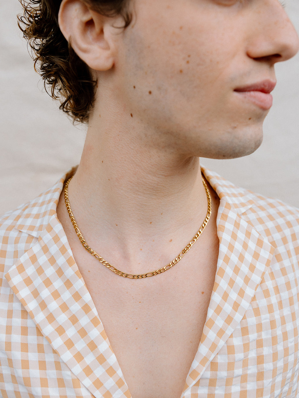 Model Wearing Gold Figaro Chain Necklace