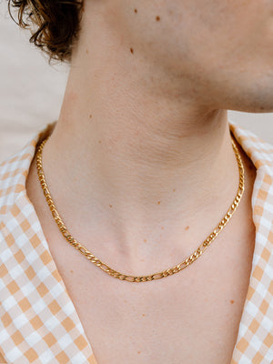 Closer Up Image of Model Wearing Gold Figaro Chain Necklace