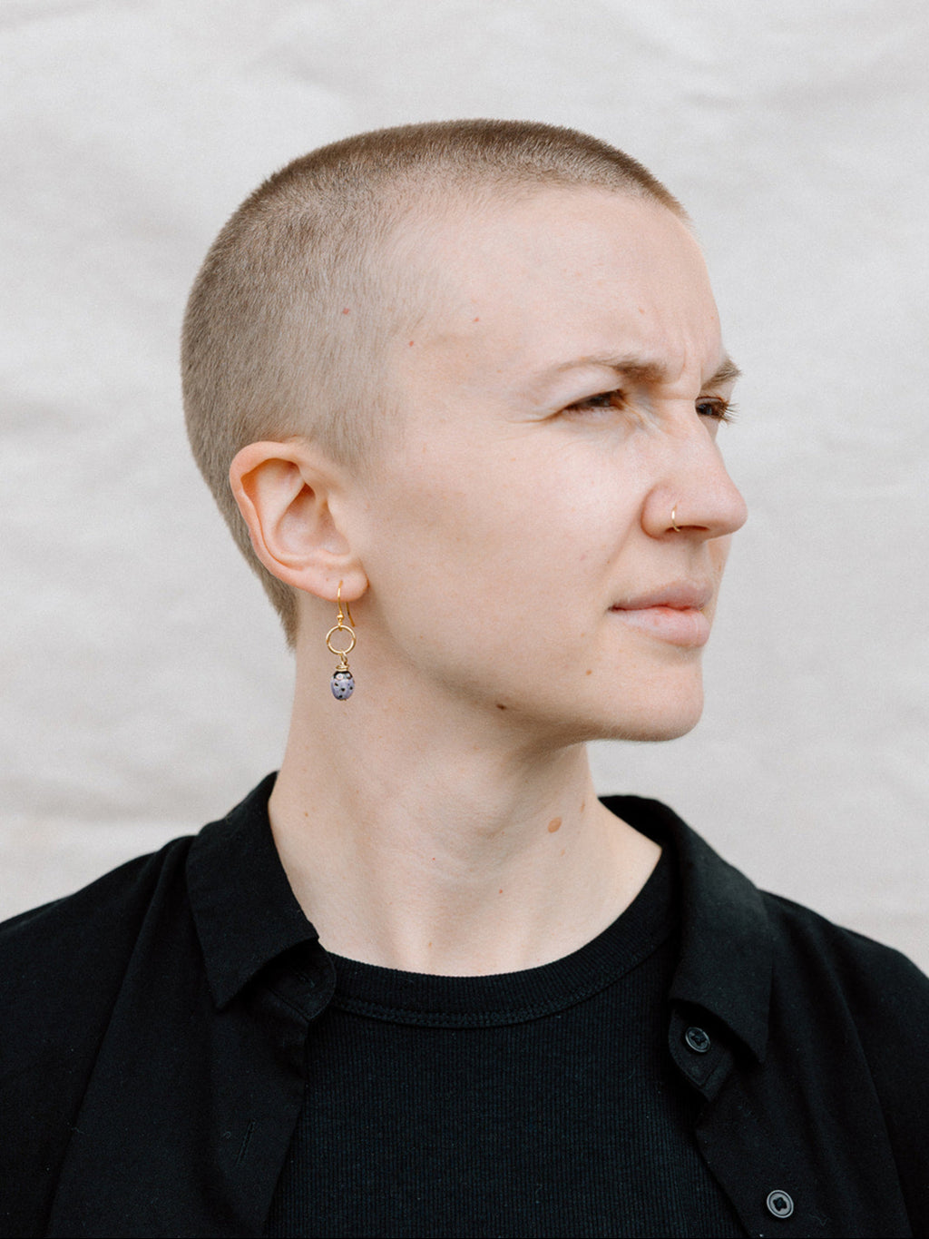 Model Wearing Purple “Lucky” Lady Bug Earrings With Gold Ring and Hook