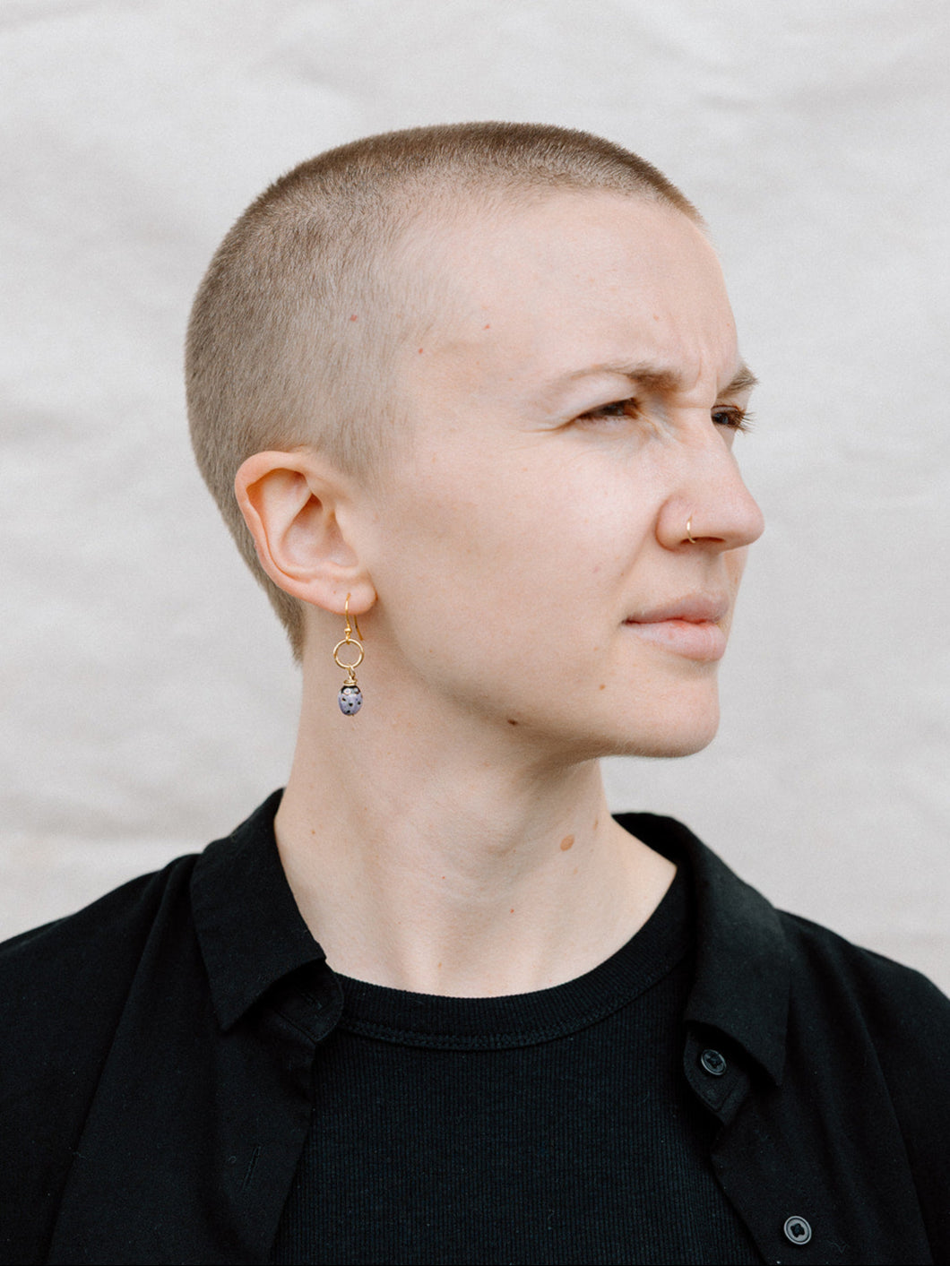 Model Wearing Purple “Lucky” Lady Bug Earrings With Gold Ring and Hook