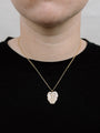 Model Wearing Gold Heart Necklace With Small Gold Rolo Chain