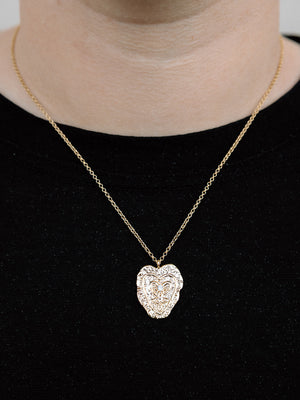 Closer Up Image of Model Wearing Gold Heart Necklace With Small Gold Rolo Chain