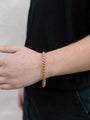 Closer Up Image of Model Wearing Shiny Gold Plated Snake Chain Bracelet