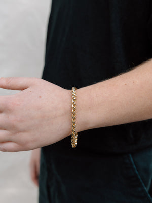 Closer Up Image of Model Wearing Shiny Gold Plated Snake Chain Bracelet