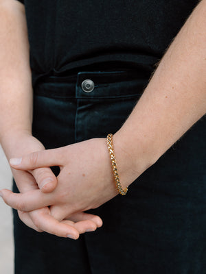Model Wearing Shiny Gold Plated Snake Chain Bracelet